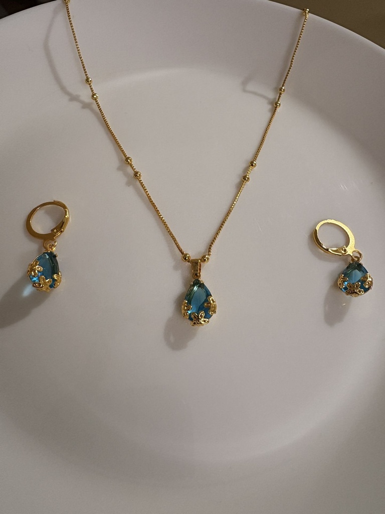 Imitation Golden Finish Jewelry Featuring A Radiant Aqua Blue Teardrop Design